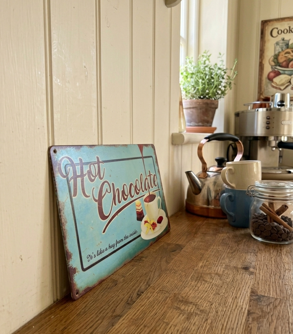 VINTAGE STYLE METAL SIGN (REPRODUCTION) HOT CHOCOLATE LEANING AGAINST A KITCHEN WALL