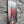 VINTAGE STYLE METAL SIGN WALL ART - SIDE ANGLE-  HANGING ON A BRICK WALL WITH THE IMAGE OF THREE CHILLIS ON IT