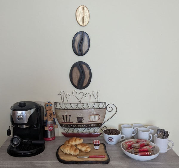 Coffee Bean Wall Art (Set of 3) including a Gold coffee bean - Ash wood Yakisugi Style displayed on wall in Coffee Shop setting