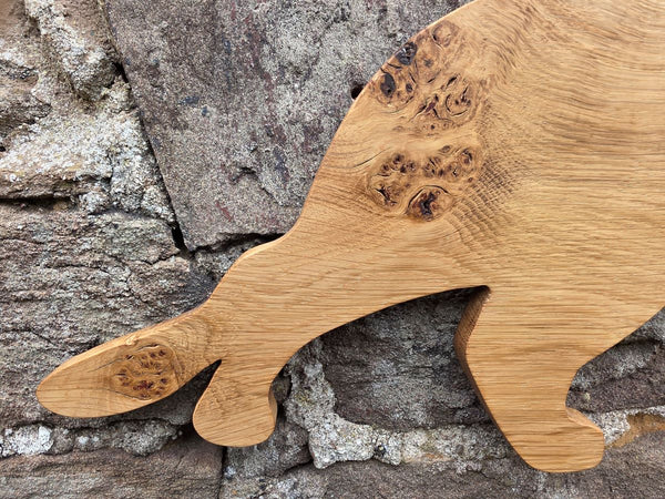 Stalking cat wooden wall art close up of tail & back legs