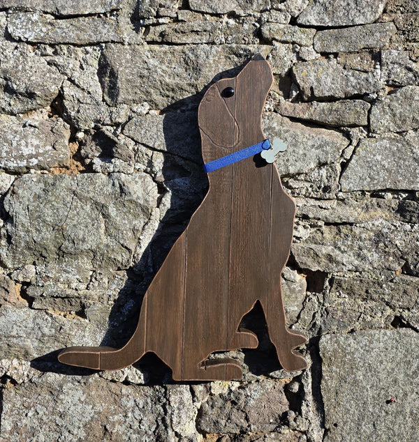 Wooden Labrador Retriever  wall art against a stone wall
