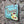 VINTAGE STYLE METAL SIGN (REPRODUCTION) HOT CHOCOLATE HANGING ON A STONE WALL - OTHER SIDE ANGLE VIEW