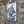 A rectangular vintage style metal sign  with a distressed white background featuring a black-and-white owl image and the text 'ARE YOU POOPING!' in black. The sign is photographed against a stone wall with a different side angle view.