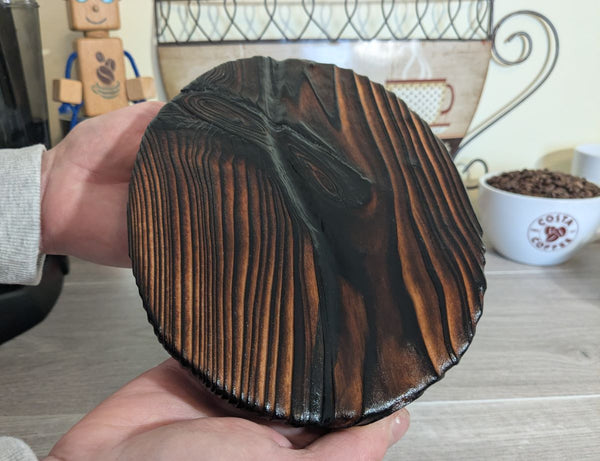 coffee bean (large size) wall art decor up close showing Yakisugi style Douglas Fir wood being held to show sizing