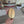 Gold coffee bean (small size) wall art decor up close showing Yakisugi style Ash wood being held for sizing