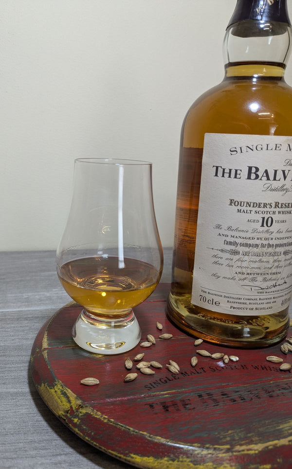 decorative oak barrel lid display plinth with whisky glass and bottle