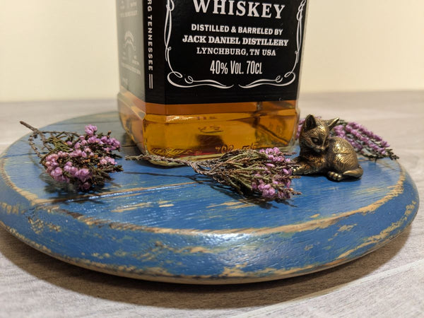 decorative oak barrel lid - blue distressed effect with heather and brass cat ornament