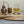 angels share oak display plinth with miniature barrel & copper still with whisky glass