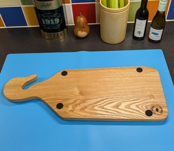 under side of live-edge ash duck style charcuterie/serving board