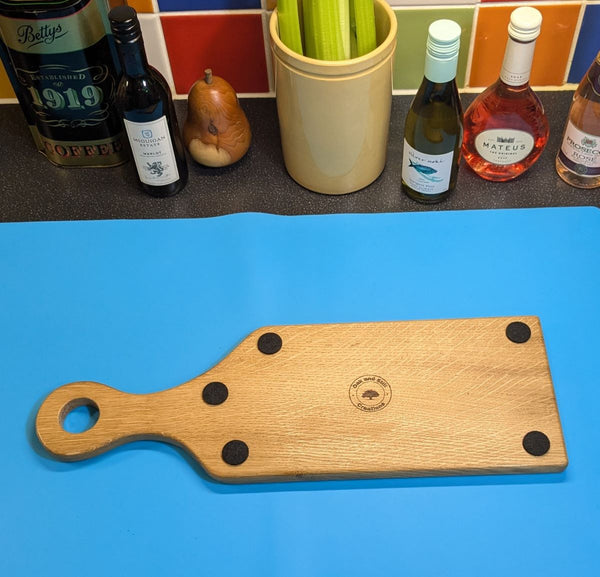 under side of stinky cheese oak cheeseboard