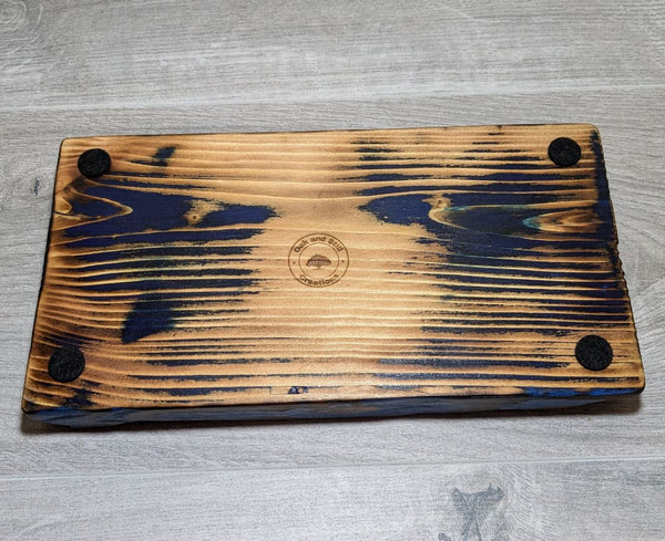 under side of douglas fir display plinth with copper flame-painted insert