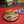 Ash wood 'Coffee Bean style' serving board displayed with croissant, butter, jam & funky red butter knife along side a cup of coffee
