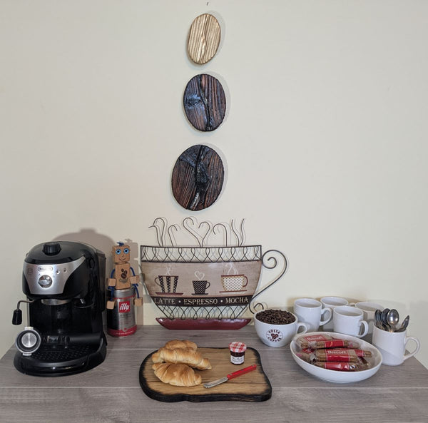 Coffee Bean Wall Art (Set of 3) including a Gold coffee bean - Douglas Fir wood Yakisugi Style displayed on wall in Coffee Shop setting