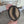 Large ash wood coffee bean being held to show sizing
