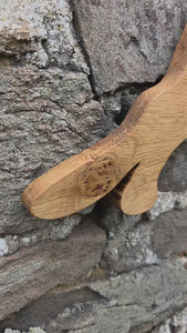 Stalking cat wooden wall art on a stone wall video clip