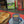 Ash wood 'Coffee Bean style' serving board displayed with croissant, butter, jam & funky red butter knife along side a cup of coffee video clip