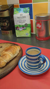 Ash wood 'Coffee Bean style' serving board displayed with croissant, butter, jam & funky red butter knife along side a cup of coffee video clip