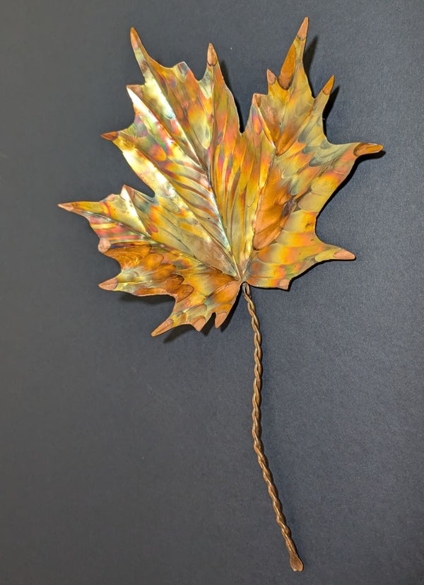 flame painted copper maple leaf close up view of copper leaf with twisted copper stem