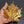 flame painted copper maple leaf close up view of copper leaf being held for sizing and detail showing the amazing colours