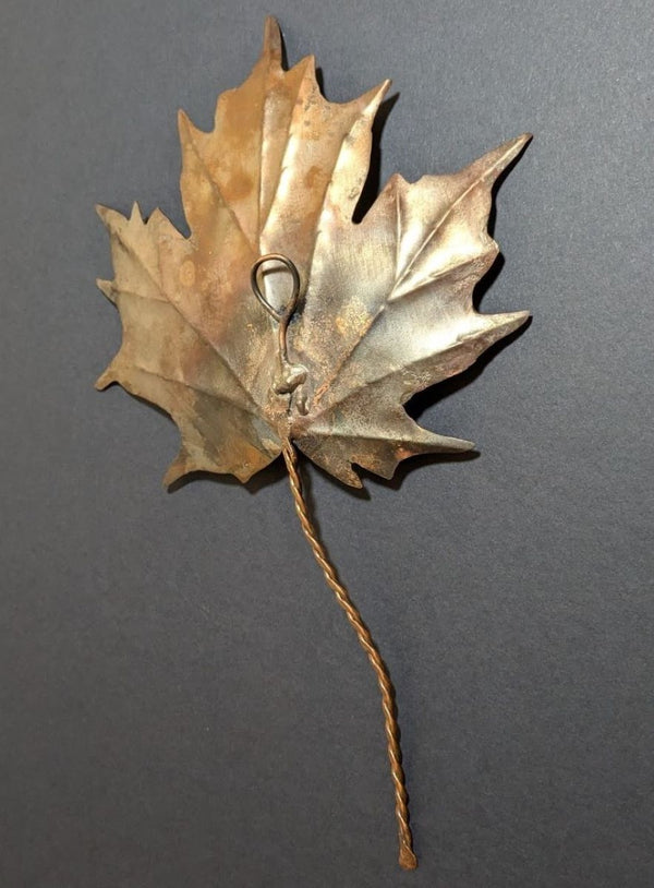 flame painted copper maple leaf close up view of copper leaf reverse side with copper hanging loop